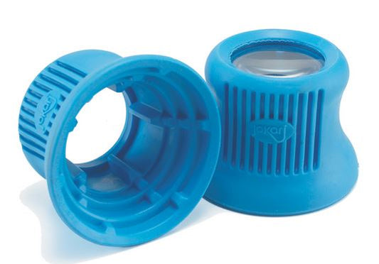 The medicine bottle opener is blue with a large opening on the bottom where the head of the bottle goes. The top has a smaller opening with a 4x magnifier. The plastic has ridges for easy gripping and easy opening