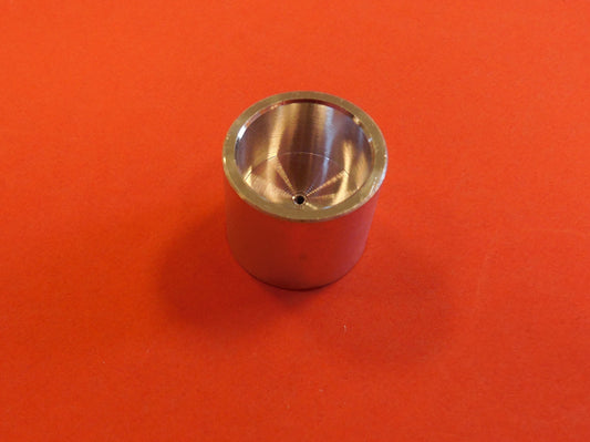 Tiny metal round piece with a hole in the middle for the syringe