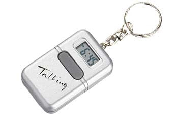 Silver little box on a key chain that has a button to announce the time and a digital face that shows the time.