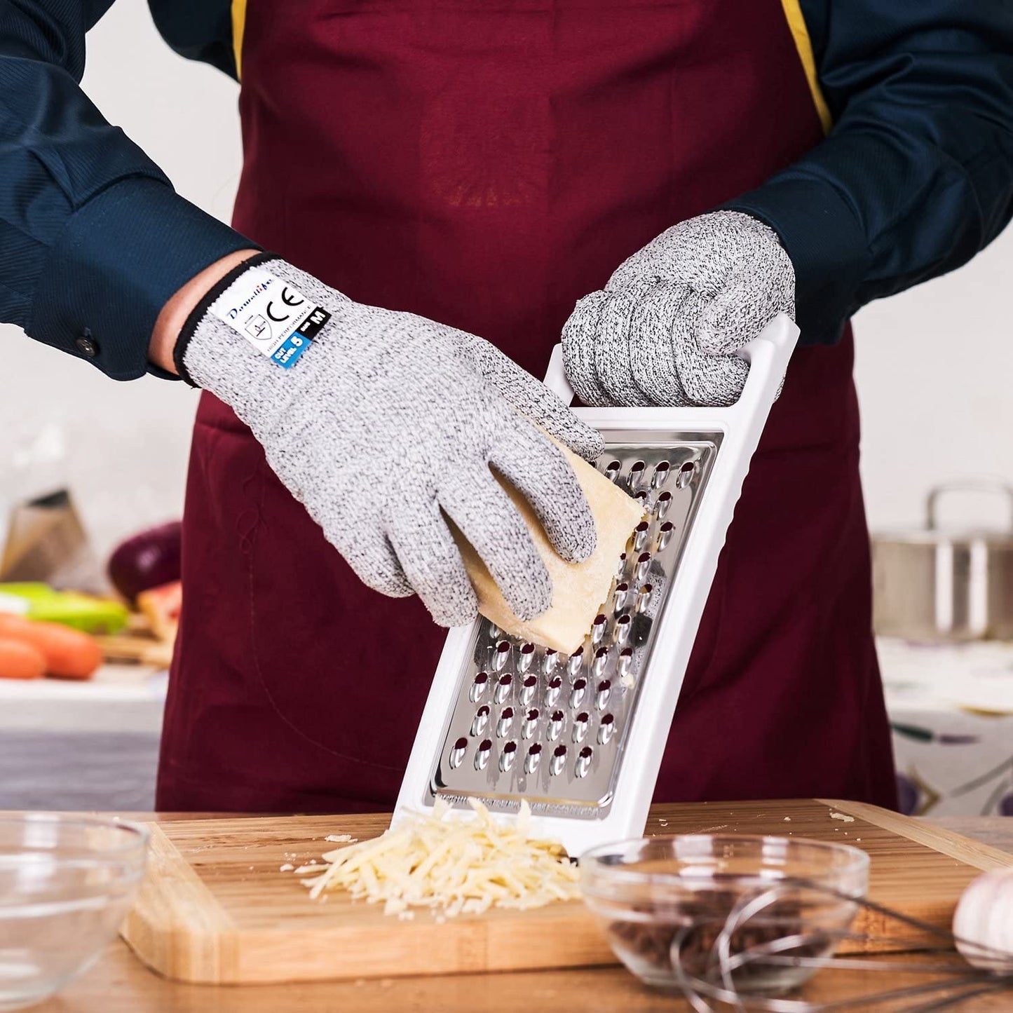 Someone grating cheese while wearing the gloves