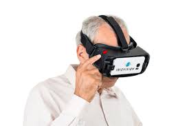 An older person using the IrisVision for looking at something