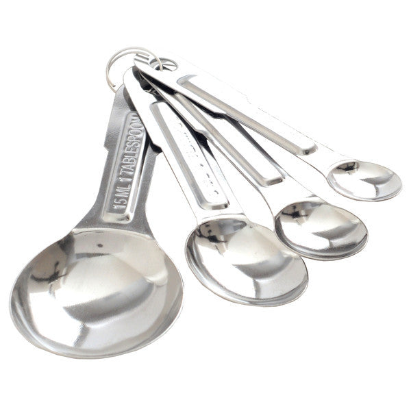 A set of metal measuring spoons