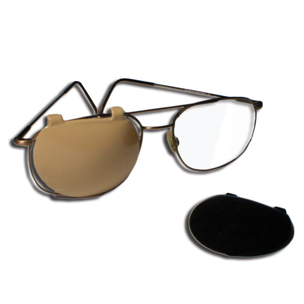 A beige colored occluder is attached to right lens to block out the light. A black occluder is in front of the glasses