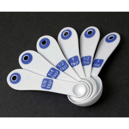 A set of white measuring spoons with white letters and numbers with a blue background