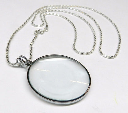 Always be prepared and look stylish while doing it with this silver pendant magnifier with chain